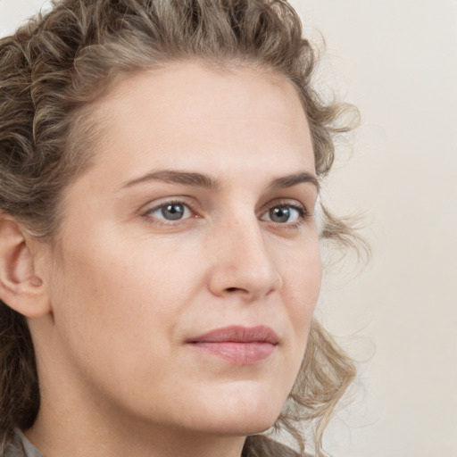 Neutral white young-adult female with medium  brown hair and grey eyes