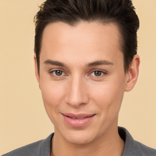 Joyful white young-adult male with short  brown hair and brown eyes