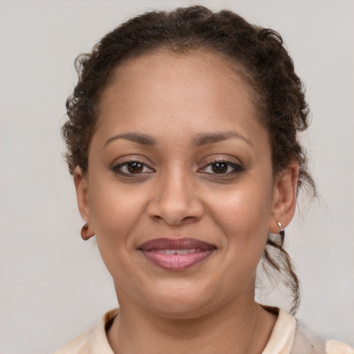 Joyful latino young-adult female with short  brown hair and brown eyes