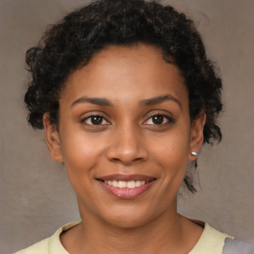 Joyful latino young-adult female with short  brown hair and brown eyes
