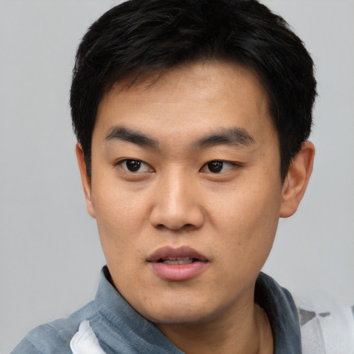 Neutral asian young-adult male with short  black hair and brown eyes