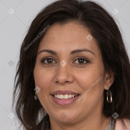 Joyful white adult female with long  brown hair and brown eyes