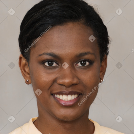 Joyful black young-adult female with short  black hair and brown eyes