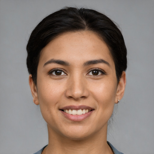 Joyful white young-adult female with medium  brown hair and brown eyes