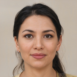 Joyful white young-adult female with medium  brown hair and brown eyes