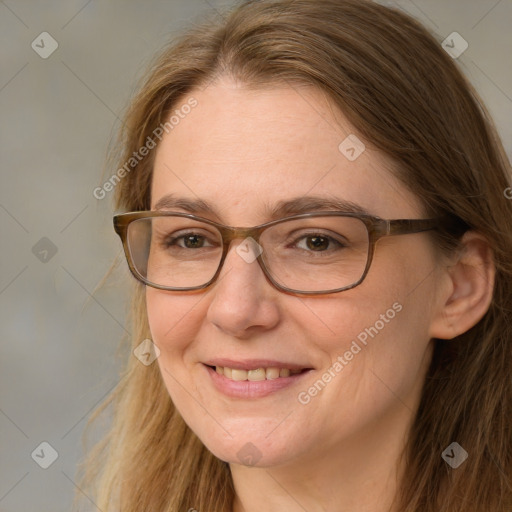 Joyful white adult female with long  brown hair and brown eyes