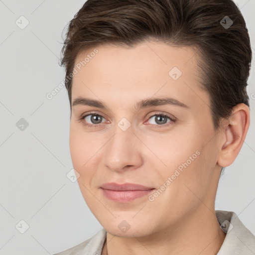 Joyful white young-adult female with short  brown hair and brown eyes