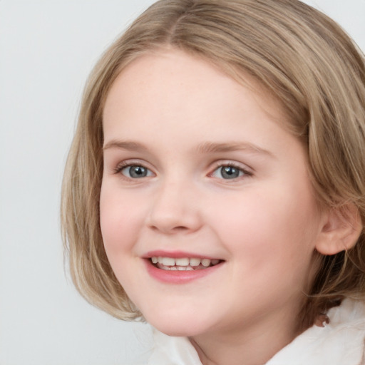 Joyful white child female with medium  brown hair and blue eyes