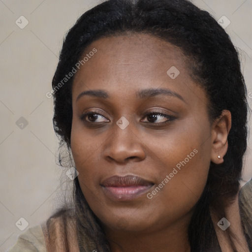 Joyful black young-adult female with long  black hair and brown eyes