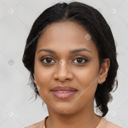 Joyful black young-adult female with medium  brown hair and brown eyes