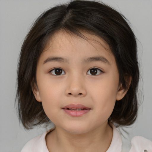 Joyful white child female with medium  brown hair and brown eyes
