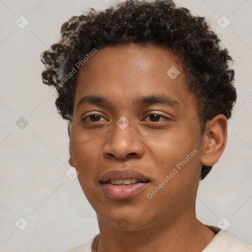 Joyful black young-adult male with short  brown hair and brown eyes