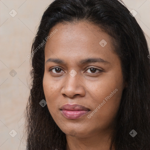 Joyful black young-adult female with long  brown hair and brown eyes