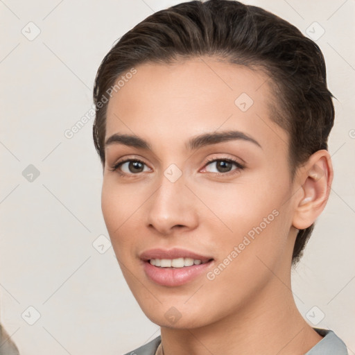 Joyful white young-adult female with short  brown hair and brown eyes