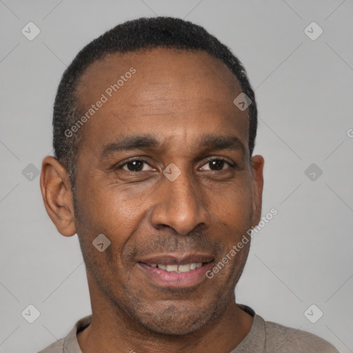 Joyful black adult male with short  black hair and brown eyes