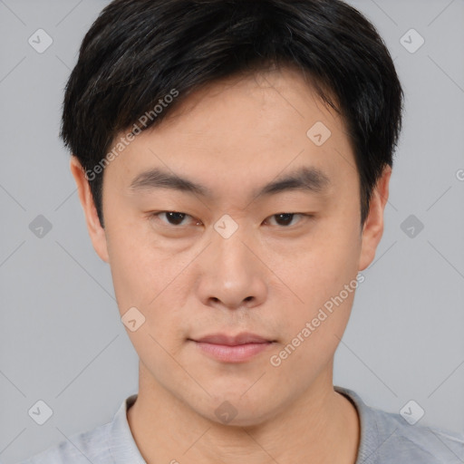 Neutral asian young-adult male with short  brown hair and brown eyes