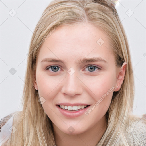 Joyful white young-adult female with long  brown hair and blue eyes