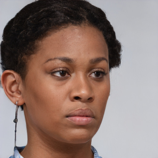 Neutral black young-adult female with short  brown hair and brown eyes