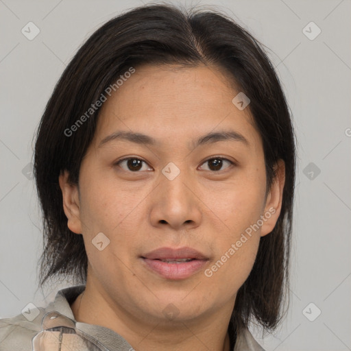 Joyful asian adult female with medium  brown hair and brown eyes