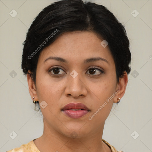 Joyful latino young-adult female with short  brown hair and brown eyes