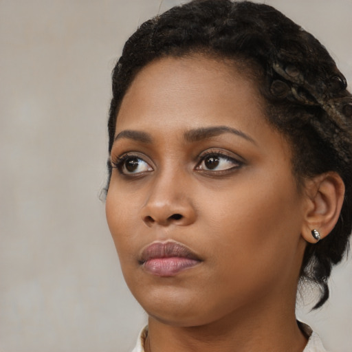 Neutral black young-adult female with medium  black hair and brown eyes