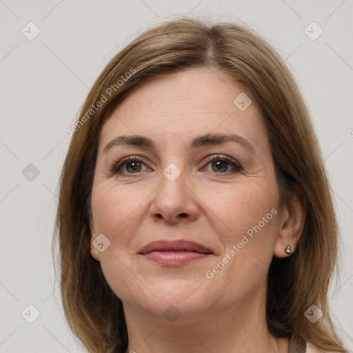 Joyful white adult female with medium  brown hair and grey eyes