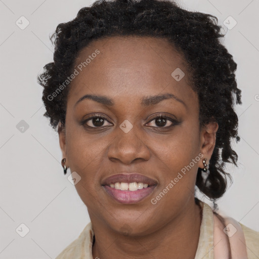 Joyful black young-adult female with long  brown hair and brown eyes