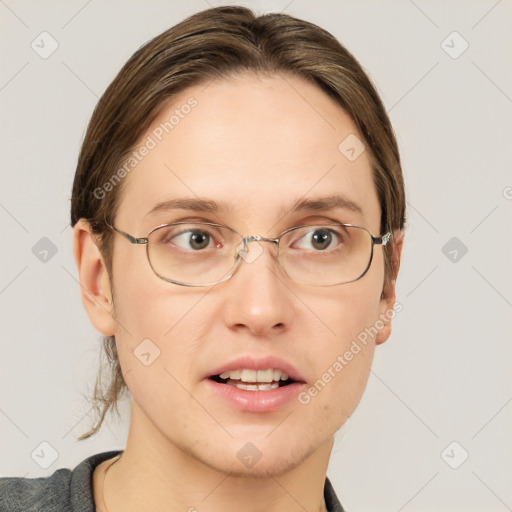 Joyful white adult female with medium  brown hair and grey eyes