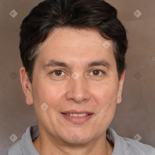 Joyful white adult male with short  brown hair and brown eyes