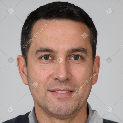 Joyful white adult male with short  brown hair and brown eyes