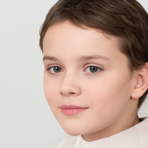 Joyful white child female with short  brown hair and brown eyes