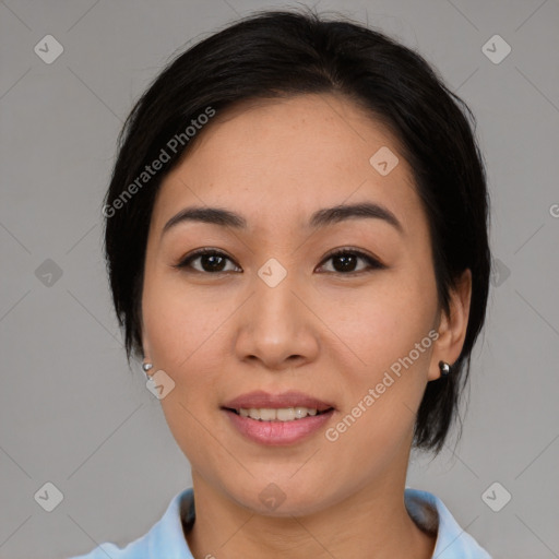Joyful asian young-adult female with medium  black hair and brown eyes
