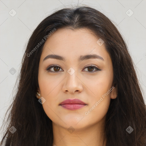 Joyful latino young-adult female with long  brown hair and brown eyes