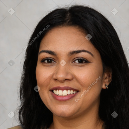 Joyful latino young-adult female with long  brown hair and brown eyes