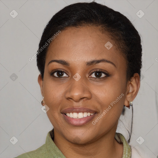 Joyful black young-adult female with short  brown hair and brown eyes