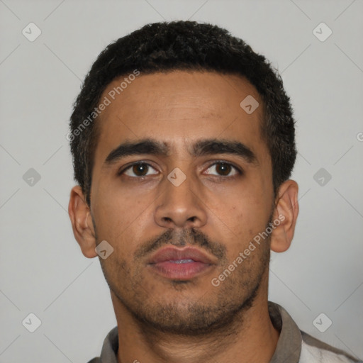 Neutral latino young-adult male with short  black hair and brown eyes