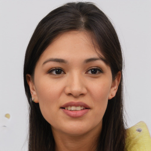 Joyful asian young-adult female with long  brown hair and brown eyes