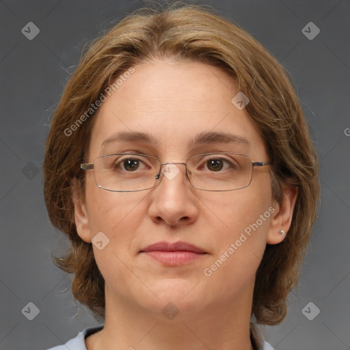 Joyful white adult female with medium  brown hair and green eyes