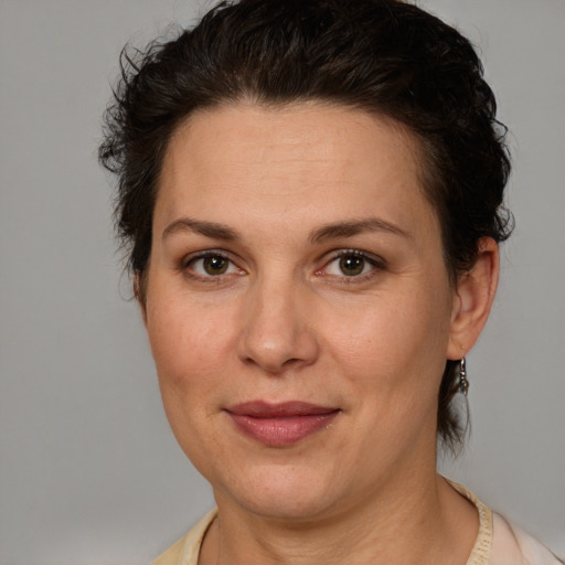 Joyful white adult female with short  brown hair and brown eyes