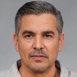 Neutral white adult male with short  black hair and brown eyes