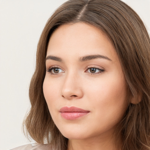 Neutral white young-adult female with long  brown hair and brown eyes