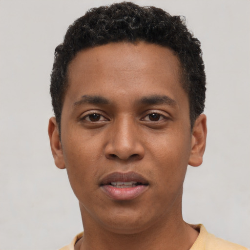 Neutral black young-adult male with short  black hair and brown eyes