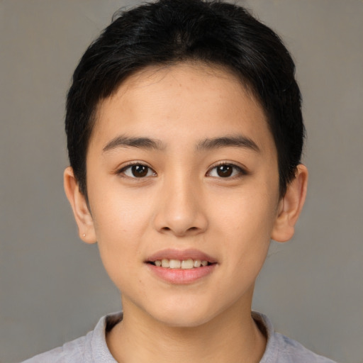 Joyful asian young-adult female with short  black hair and brown eyes