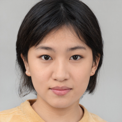 Neutral asian young-adult female with medium  brown hair and brown eyes