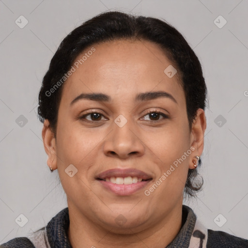 Joyful latino adult female with medium  brown hair and brown eyes