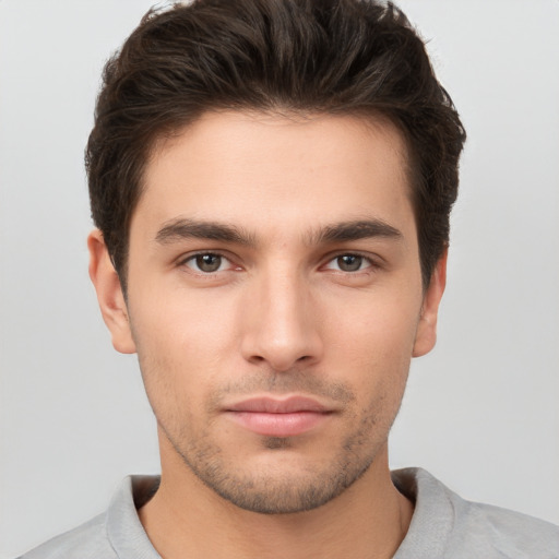 Neutral white young-adult male with short  brown hair and brown eyes