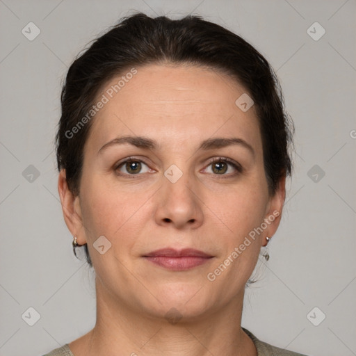 Joyful white adult female with short  brown hair and grey eyes