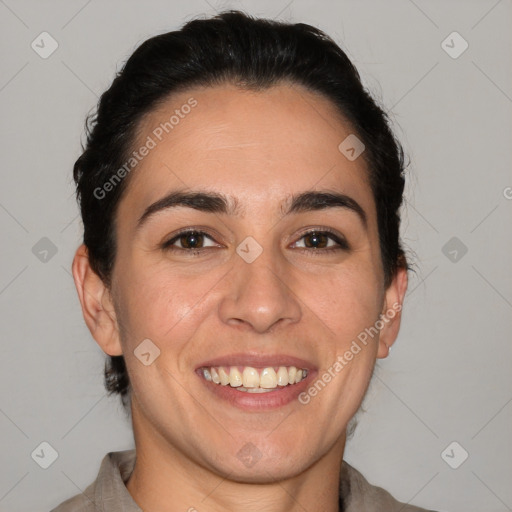 Joyful white adult female with short  brown hair and brown eyes