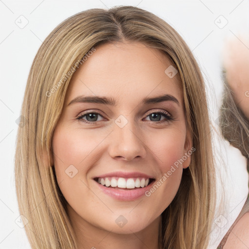 Joyful white young-adult female with long  brown hair and green eyes