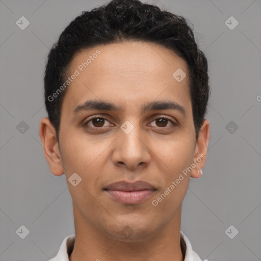 Joyful latino young-adult male with short  brown hair and brown eyes